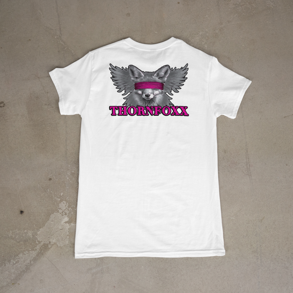 Dreamz Design Co T-Shirt with Fox Graphic and Text White T-shirt featuring a fox graphic with "THORNFOXX" text in pink, casual streetwear style.