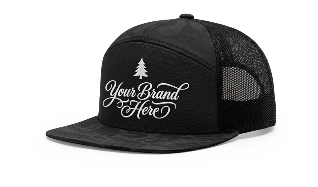 Dreamz Design Co Custom Cap Custom black trucker hat with "Your Brand Here" text and pine tree logo.